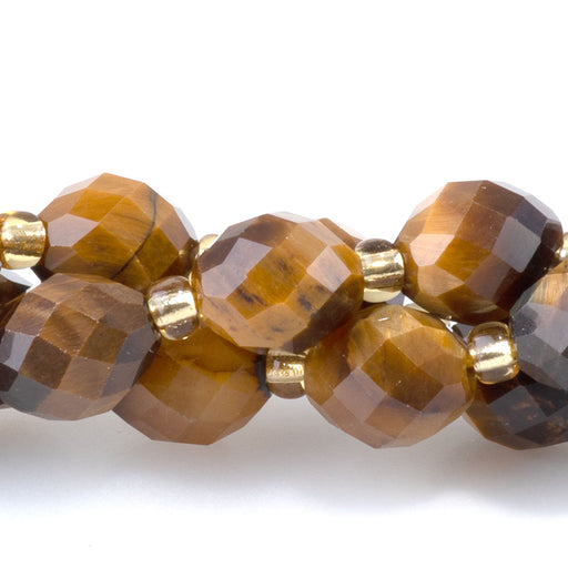 This is a Dakota Stones 7x8mm Tiger Eye Rice Gemstone strand with A grade faceted beads in 15-16 inch strand.