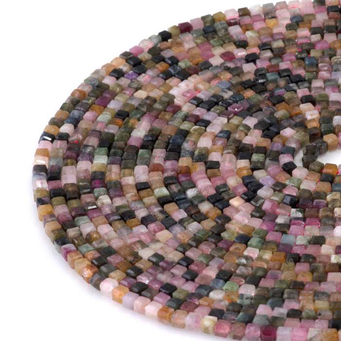 This is a Dakota Stones 3mm Multi Tourmaline Gemstone strand with table cut faceted cube beads in 15-16 inch strand.