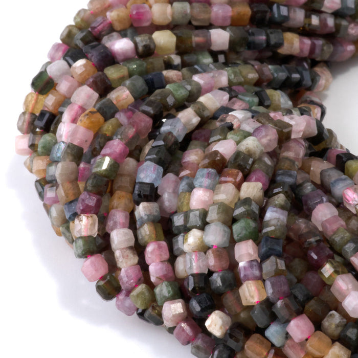 This is a Dakota Stones 3mm Multi Tourmaline Gemstone strand with table cut faceted cube beads in 15-16 inch strand.