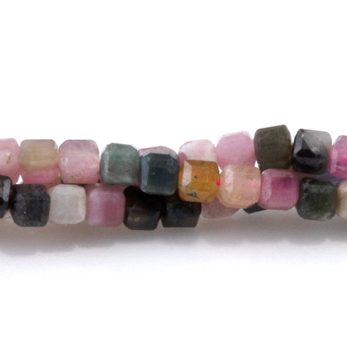 This is a Dakota Stones 3mm Multi Tourmaline Gemstone strand with table cut faceted cube beads in 15-16 inch strand.