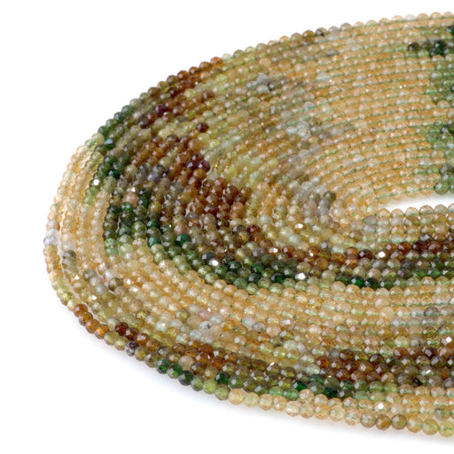 This is a Dakota Stones 3mm Yellow Green Banded Tourmaline Gemstone strand with faceted round beads in 15-16 inch strand.