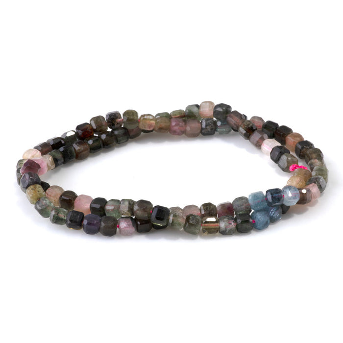 This is a Dakota Stones 4mm Multi Tourmaline Gemstone strand with A grade table cut faceted cube beads in 15-16 inch strand.