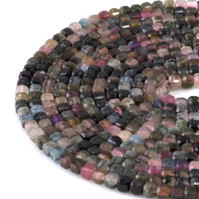 This is a Dakota Stones 4mm Multi Tourmaline Gemstone strand with A grade table cut faceted cube beads in 15-16 inch strand.