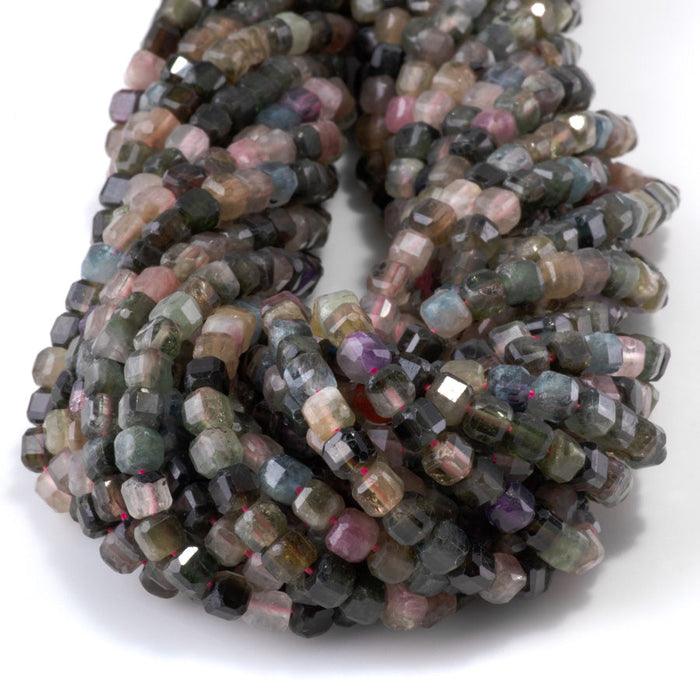 This is a Dakota Stones 4mm Multi Tourmaline Gemstone strand with A grade table cut faceted cube beads in 15-16 inch strand.