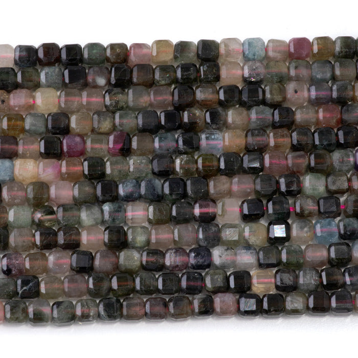 This is a Dakota Stones 4mm Multi Tourmaline Gemstone strand with A grade table cut faceted cube beads in 15-16 inch strand.