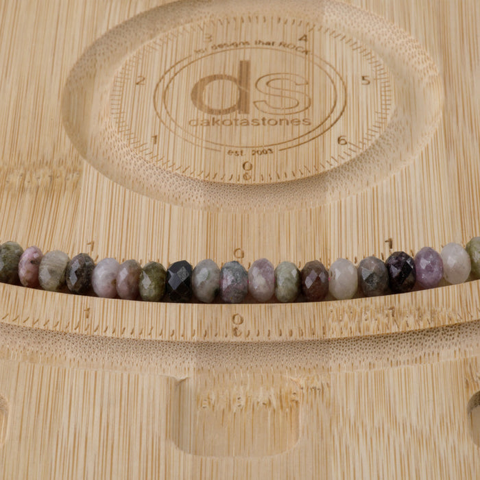 This is a Dakota Stones 5x8mm Multi Tourmaline Gemstone strand with faceted rondelle beads in 15-16 inch strand.