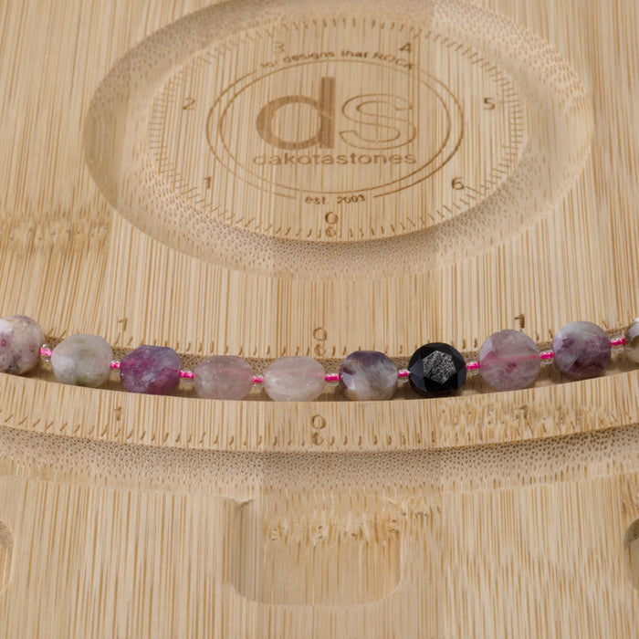This is a Dakota Stones 8mm Multi Tourmaline Gemstone strand with star cut faceted coin beads in 15-16 inch strand.