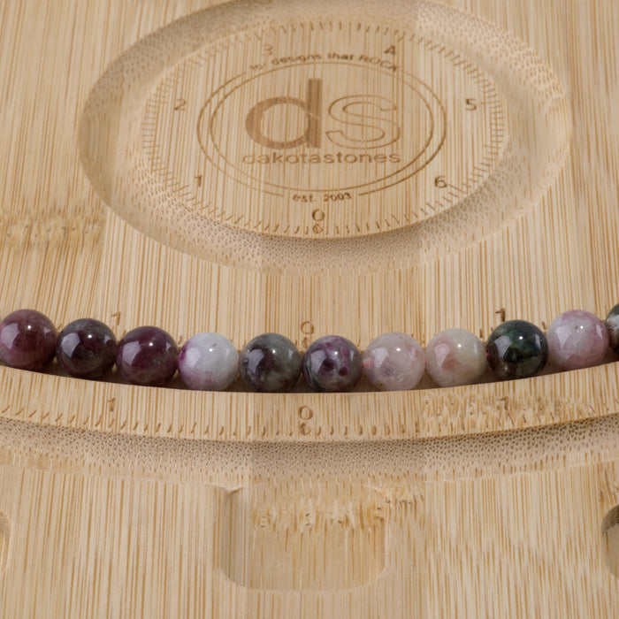 This is a Dakota Stones 8mm Multi Tourmaline Gemstone strand with A grade round beads in 15-16 inch strand.