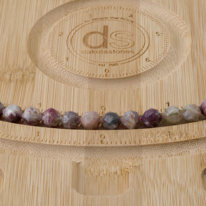 This is a Dakota Stones 8mm Multi Tourmaline Gemstone strand with double heart faceted round beads in 15-16 inch strand.
