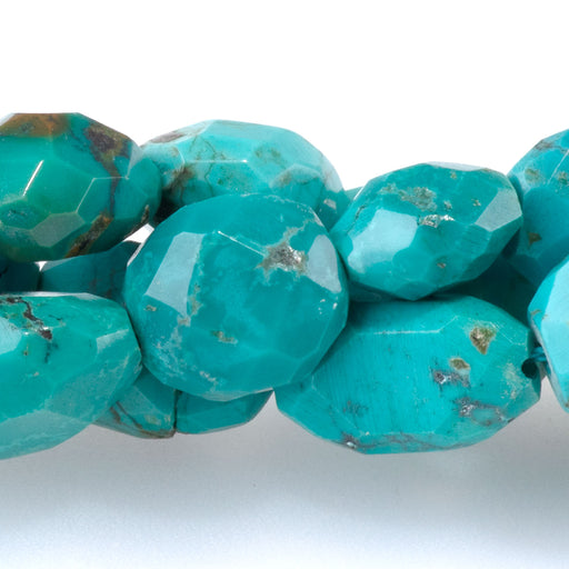 This is a Dakota Stones 8x10-13x16mm Hubei Turquoise Blue Gemstone strand with AA grade faceted free-form oval beads in 15-16 inch strand.