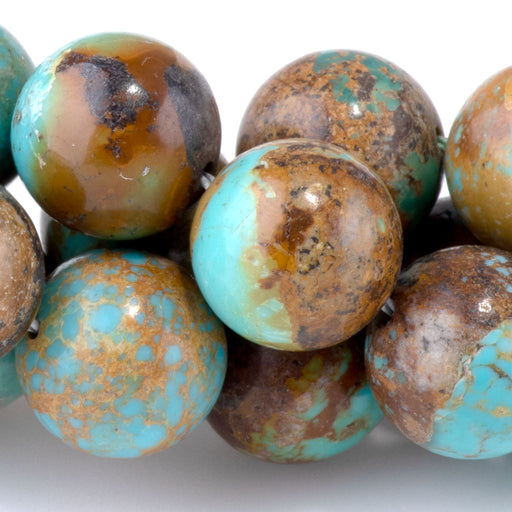 This is a Dakota Stones 11mm Hubei Turquoise Blue Gemstone strand with round beads in 15-16 inch strand.
