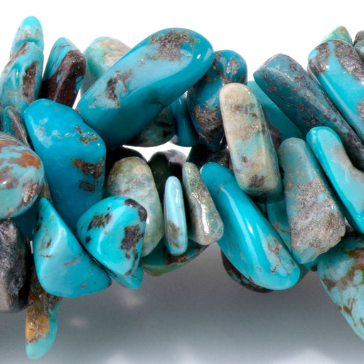 This is a Dakota Stones 10-14mm Hubei Turquoise Blue Top Drill Gemstone strand with chip beads in 15-16 inch strand.