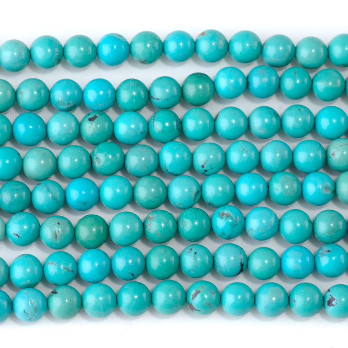 This is a Dakota Stones 6-6mm Hubei Turquoise Gemstone strand with round beads in 15-16 inch strand.