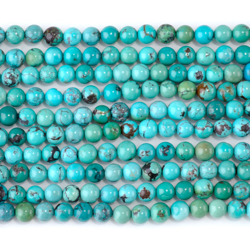 This is a Dakota Stones 5mm Hubei Turquoise Matrix Gemstone strand with round beads in 15-16 inch strand.