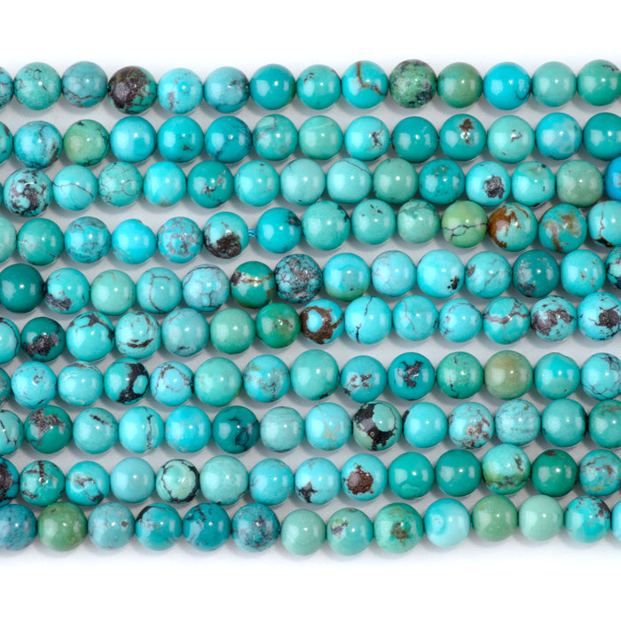This is a Dakota Stones 5mm Hubei Turquoise Matrix Gemstone strand with round beads in 15-16 inch strand.
