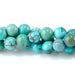 This is a Dakota Stones 5mm Hubei Turquoise Matrix Gemstone strand with round beads in 15-16 inch strand.