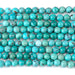 This is a Dakota Stones 6mm Hubei Turquoise Matrix Gemstone strand with round beads in 15-16 inch strand.