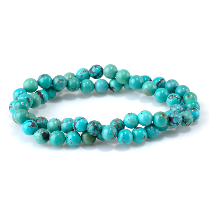 This is a Dakota Stones 6-7mm Hubei Turquoise Matrix Gemstone strand with round beads in 15-16 inch strand.