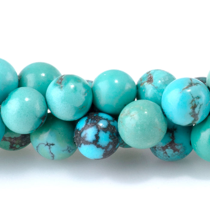 This is a Dakota Stones 6-7mm Hubei Turquoise Matrix Gemstone strand with round beads in 15-16 inch strand.