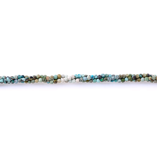 This is a Dakota Stones 2-5mm Hubei Turquoise Banded Yellow Light Gemstone strand with faceted cube beads in 15-16 inch strand.