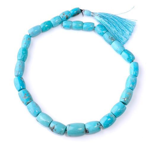 This is a Dakota Stones 10x13-13x20mm Kingman Turquoise Gemstone strand with barrel beads in 15-16 inch strand.