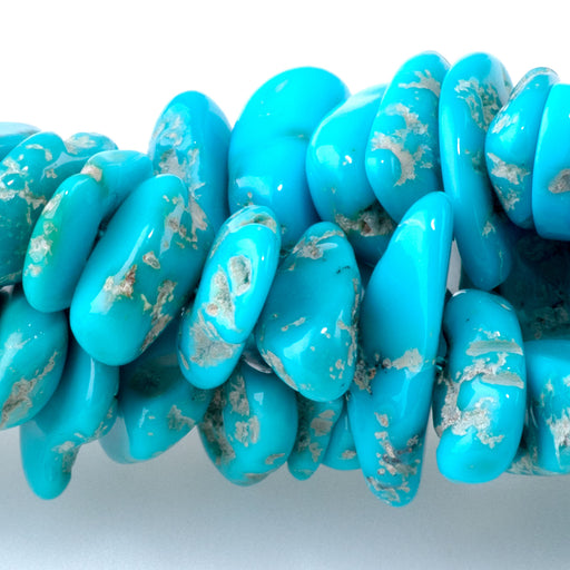 This is a Dakota Stones 10mm Sleeping Beauty Blue Green Gemstone strand with chip beads in 17-18 inch strand.