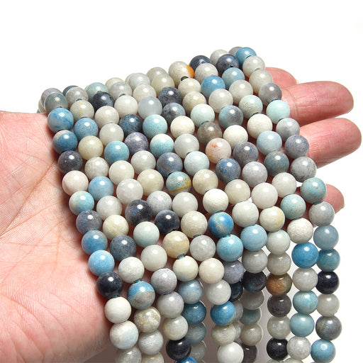 This is a Dakota Stones 8mm Trolleite Large Hole Gemstone strand with round beads in 8 inch strand.