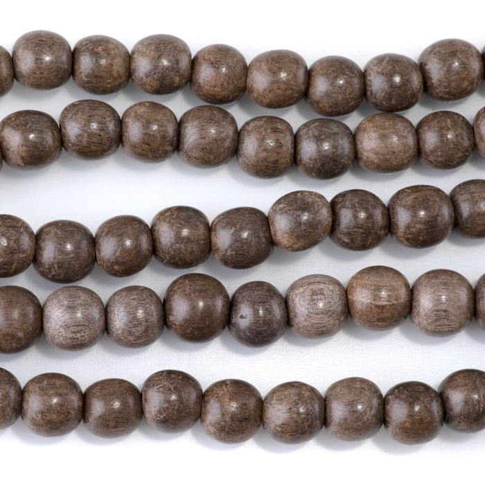 This is a Dakota Stones 10mm Gray Wood Gemstone strand with round beads in 15-16 inch strand.