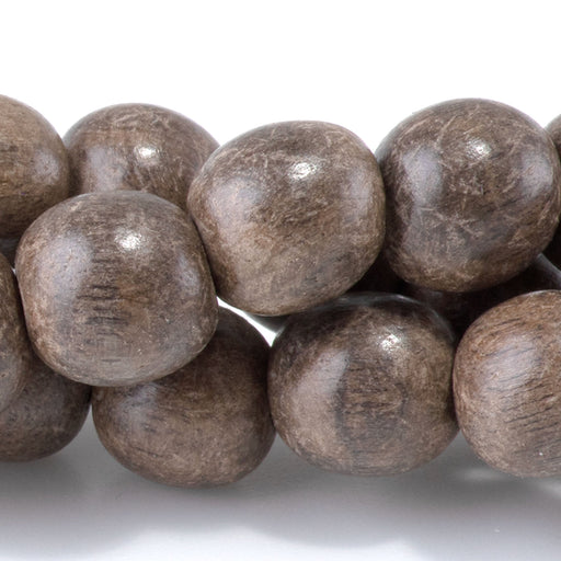 This is a Dakota Stones 10mm Gray Wood Gemstone strand with round beads in 15-16 inch strand.