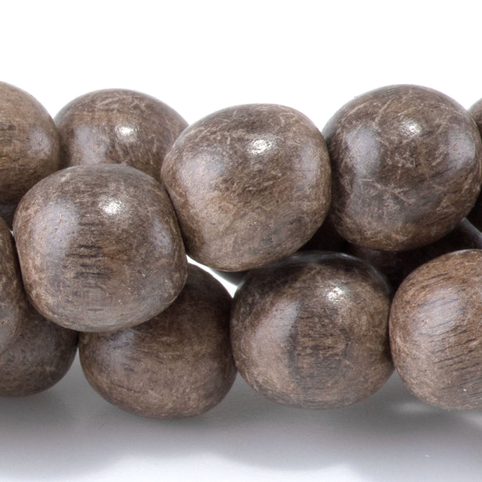 This is a Dakota Stones 10mm Gray Wood Gemstone strand with round beads in 15-16 inch strand.
