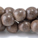 This is a Dakota Stones 10mm Gray Wood Gemstone strand with round beads in 15-16 inch strand.