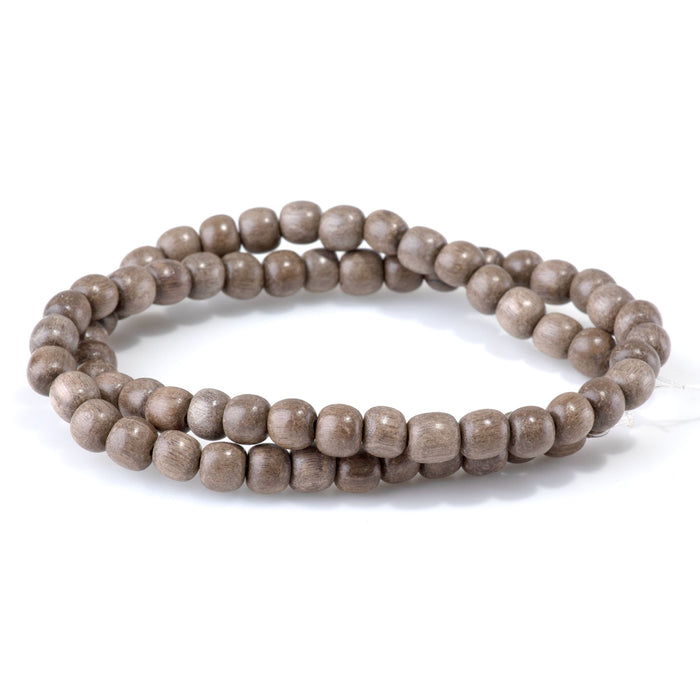 This is a Dakota Stones 6mm Gray Wood Gemstone strand with round beads in 15-16 inch strand.