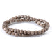 This is a Dakota Stones 6mm Gray Wood Gemstone strand with round beads in 15-16 inch strand.