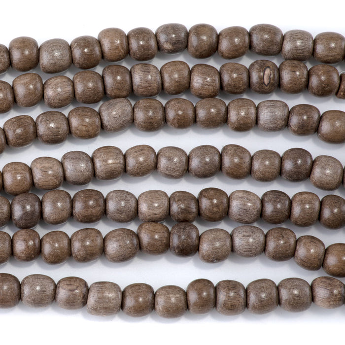 This is a Dakota Stones 6mm Gray Wood Gemstone strand with round beads in 15-16 inch strand.