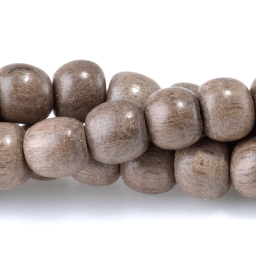 This is a Dakota Stones 6mm Gray Wood Gemstone strand with round beads in 15-16 inch strand.