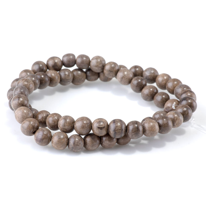 This is a Dakota Stones 8mm Gray Wood Gemstone strand with round beads in 15-16 inch strand.