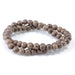 This is a Dakota Stones 8mm Gray Wood Gemstone strand with round beads in 15-16 inch strand.