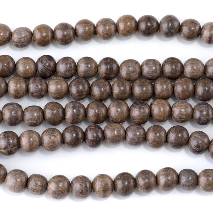 This is a Dakota Stones 8mm Gray Wood Gemstone strand with round beads in 15-16 inch strand.