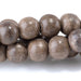 This is a Dakota Stones 8mm Gray Wood Gemstone strand with round beads in 15-16 inch strand.