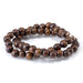 This is a Dakota Stones 10mm Madre de Cacao Gemstone strand with round beads in 15-16 inch strand.