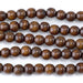 This is a Dakota Stones 10mm Madre de Cacao Gemstone strand with round beads in 15-16 inch strand.