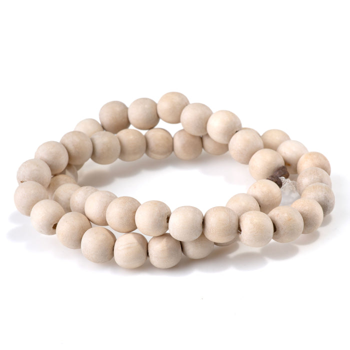 This is a Dakota Stones 10mm White Wood Gemstone strand with round beads in 15-16 inch strand.