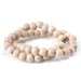 This is a Dakota Stones 10mm White Wood Gemstone strand with round beads in 15-16 inch strand.