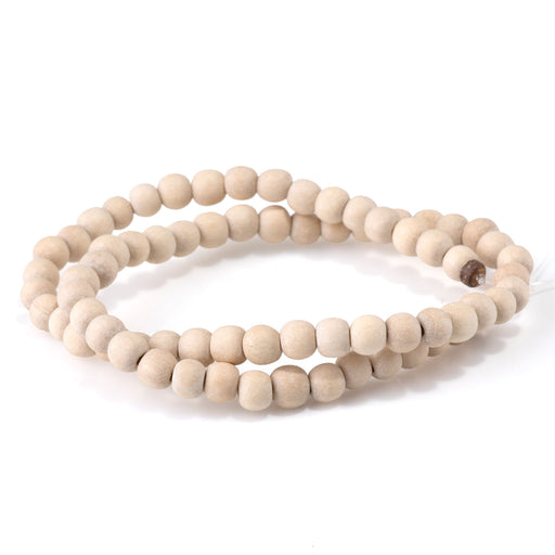This is a Dakota Stones 6mm White Wood Gemstone strand with natural round beads in 15-16 inch strand.