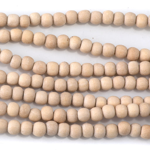 This is a Dakota Stones 6mm White Wood Gemstone strand with natural round beads in 15-16 inch strand.