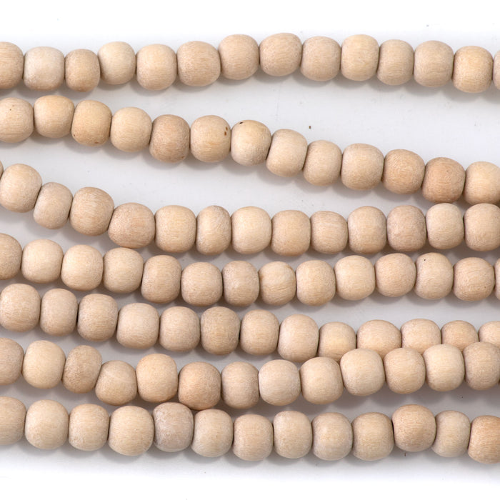 This is a Dakota Stones 6mm White Wood Gemstone strand with natural round beads in 15-16 inch strand.
