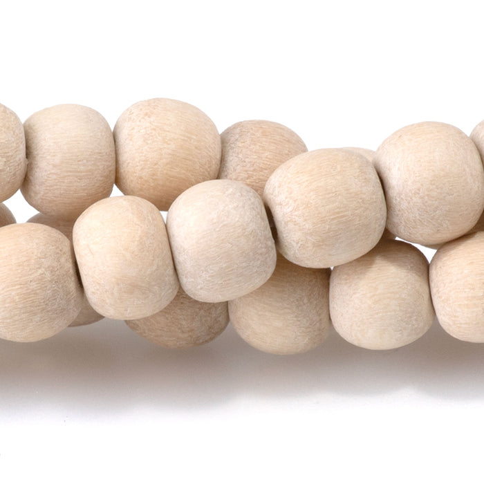 This is a Dakota Stones 6mm White Wood Gemstone strand with natural round beads in 15-16 inch strand.