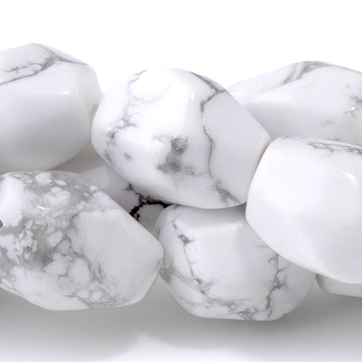 This is a Dakota Stones 10x14mm White Howlite Gemstone strand with faceted nugget beads in 15-16 inch strand.