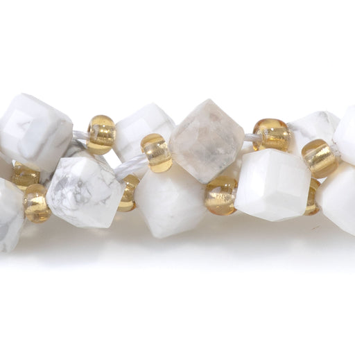 This is a Dakota Stones 4x6mm White Howlite Corner Gemstone strand with table-cut cube beads in 15-16 inch strand.