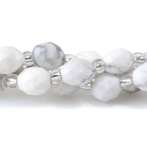 This is a Dakota Stones 4x6mm White Howlite Triangle Cut Rice Gemstone strand with faceted beads in 15-16 inch strand.